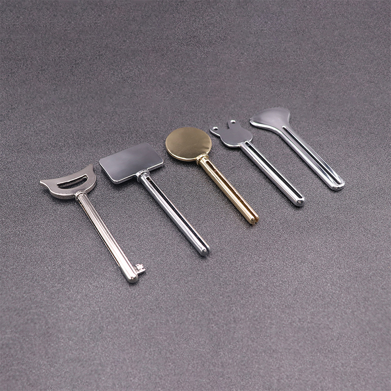 Metal Tandpasta Dispenser Ansigtsrens Tandpasta Tube Squeezer Nøgleform Kosmetik Tube Squeezer