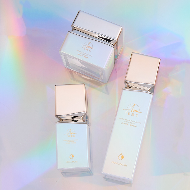 Firkantet glascremekrukke med iriserende effekt til ansigtscreme og øjencreme Firkantet glascremekrukke med iriserende effekt til ansigtscreme og øjencreme